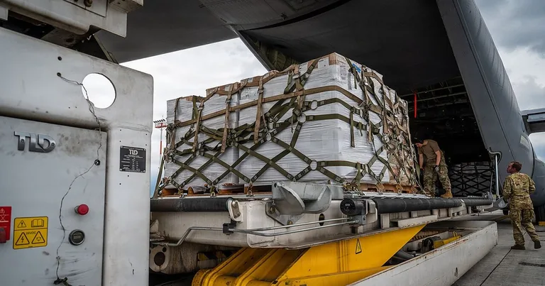 U.S. Air Force C-130J offloading pallets of relief supplies at Tribhuvan International Airport after the August 2026 floods in Nepal
