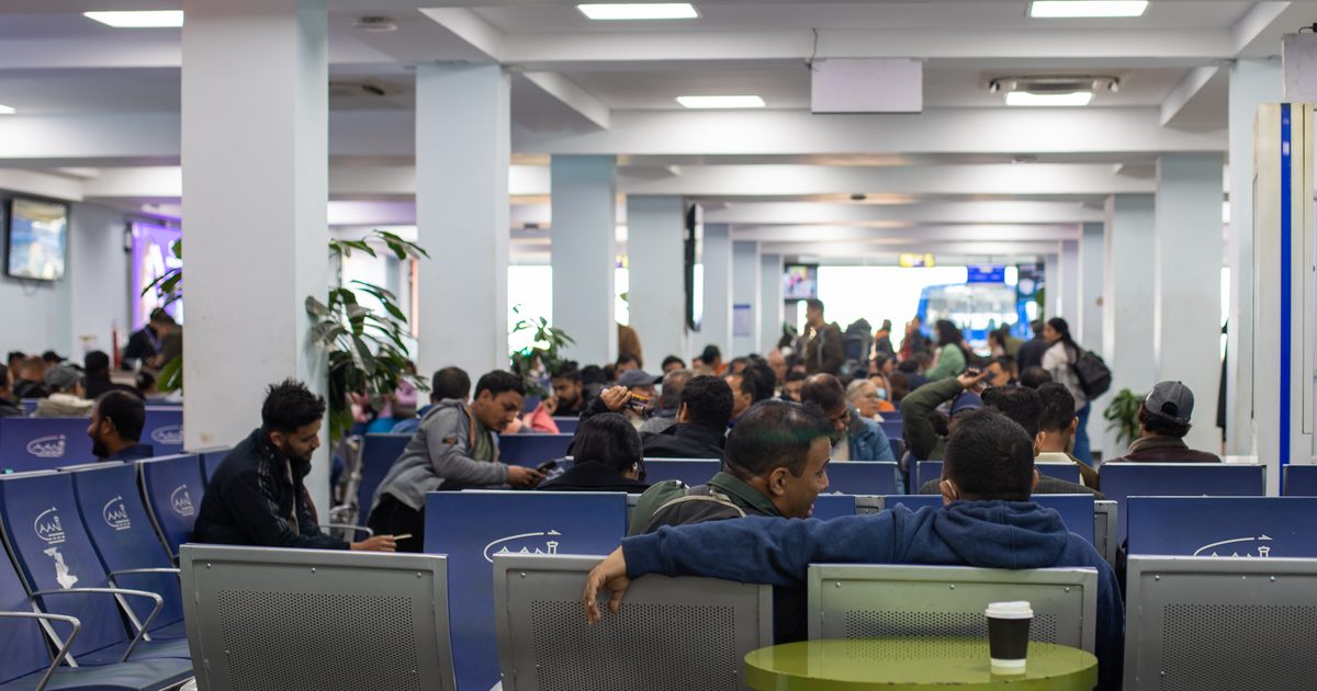Passengers waiting in the terminal at Kathmandu's Tribhuvan International Airport, the gateway for the migrant workers whose remittances reached 35.8% of Nepal's GDP