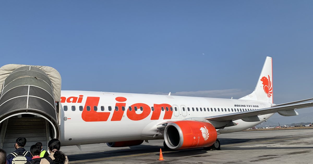 Passengers boarding a Thai Lion Air Boeing 737-800 at Kathmandu's Tribhuvan International Airport, the gateway through which most Nepali migrant workers leave for jobs abroad