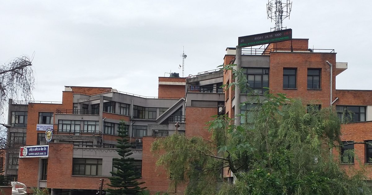 The Nepal Stock Exchange building in Kathmandu, its rooftop ticker board showing live share prices
