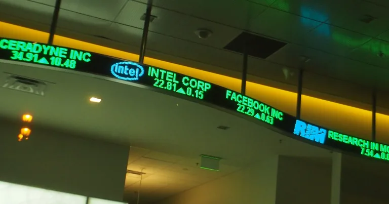 An electronic stock ticker board showing share prices and index values (representative image)