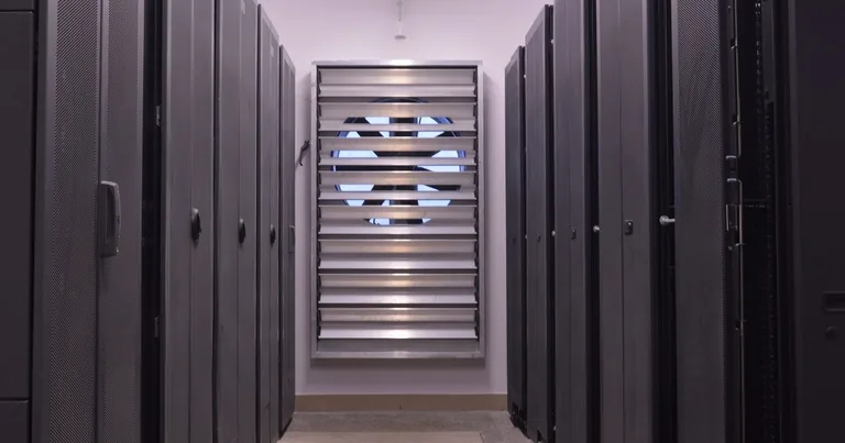 Corridor between server racks inside a data center