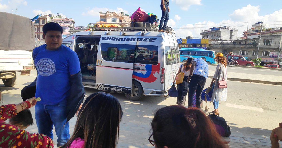 Travellers boarding a packed van in Kathmandu to head home for Dashain, the festival that drives Nepal's biggest annual surge in cash spending