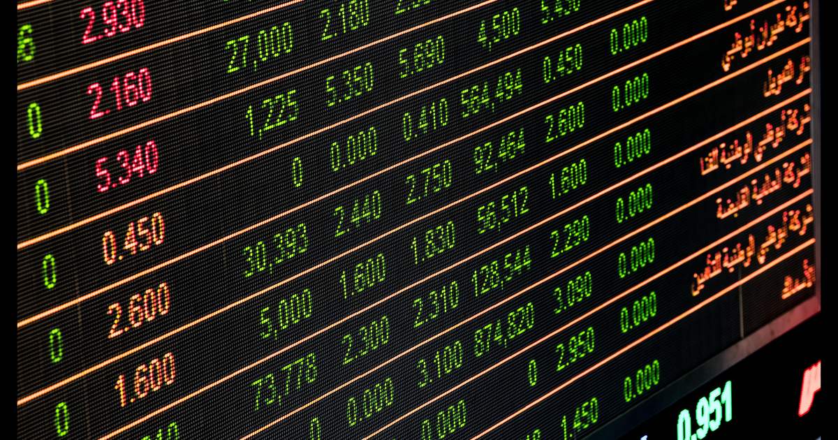 An electronic stock market price board with share prices and trading volumes in green and red (representative image)