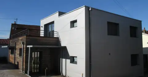 A detached house clad in insulated sandwich panels, the prefabricated building material that SY Panel Nepal manufactures